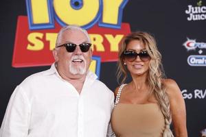 LOS ANGELES JUN 11 - John Ratzenberger, Julie Blichfeldt at the Toy Story 4 Premiere at the El Capitan Theater on June 11, 2019 in Los Angeles, CA photo
