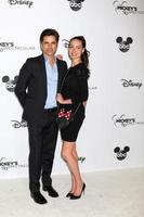 LOS ANGELES OCT 6 - John Stamos, Caitlin McHugh at the Mickey s 90th Spectacular Taping at the Shrine Auditorium on October 6, 2018 in Los Angeles, CA photo
