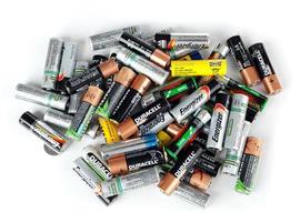 Different types of used batteries ready for recycling photo