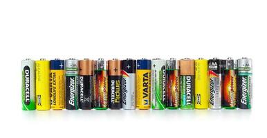 Different types of used batteries ready for recycling photo