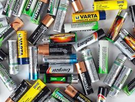 Different types of used batteries ready for recycling photo