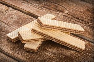 Wafers on wooden table. photo