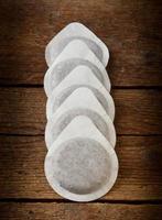 Coffee pods on wooden table photo