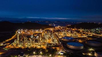 Oil refinery industry at night photo