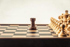 Chess on board  white backgroung. Confrontation concept photo