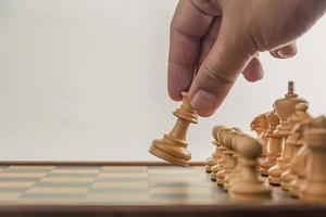 Chess on board with hand , white background photo