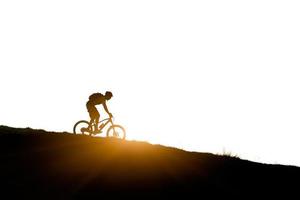 Cyclist in the mountains  downhill mountain bike photo