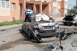 KHARKIV, UKRAINE - May, 04, 2022. Burned and broken car. War in Ukraine 2022. Russian missiles in Kharkiv Ukraine. Russian aggression, conflict. Russian attack on Ukraine. photo