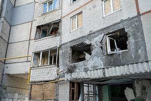 KHARKIV, UKRAINE - May, 04, 2022. War in Ukraine 2022. Destroyed, bombed and burned residential building after Russian missiles in Kharkiv Ukraine. Russian aggression. Russian attack on Ukraine. photo