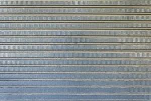 Dirty rolling iron door gray warehouse door abstract background photo