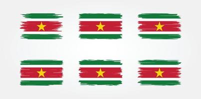 colección de pinceles de bandera de surinam. bandera nacional vector