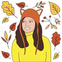 a pretty girl in a hat with ears and a sweater, against the background of autumn leaves.