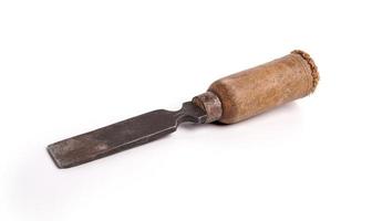 Old rusty chisel isolated on a white background Woodworking carpenter chisel tool photo