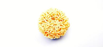 Uncooked instant noodles with negative space isolated on the gray white studio background. Food background design. Suitable for promotion of food and beverage industry and company, food advertising. photo