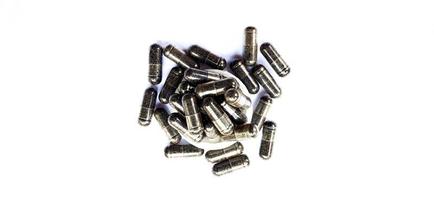 Herbal medicine black cumin capsules with negative space isolated on the gray white studio background. Nigella sativa. Suitable for promotion of health industry and company. photo