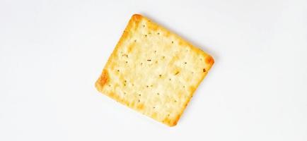 Sugarless and vegetable healthy cracker biscuit slices on the gray white studio background. Food background design. Suitable for promotion of food and beverage industry and company, food advertising. photo