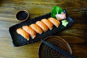 Sushi Salmon on wooden table photo