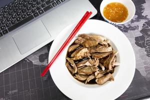 Boiled, stewed duck on the table photo