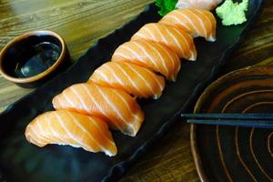 Sushi Salmon on wooden table photo