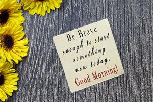 Motivational and inspirational quote on torn brown paper. Morning quote. photo