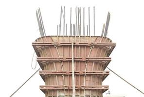 Construction and casting of concrete piles to support the weight of an expressway bridge in rural Thailand on a separate white background. photo