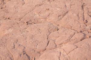Red sandstone is a large stone used for landscaping, decorating the garden to look natural with man-made and many patterns on the surface. photo