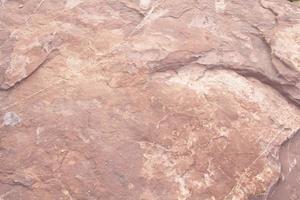 Red sandstone is a large stone used for landscaping, decorating the garden to look natural with man-made and many patterns on the surface. photo