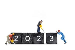 Miniature People Worker Team Create Number 2023 On Block photo