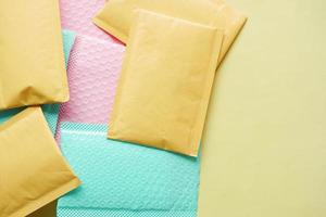 yellow paper bubble envelope on table photo