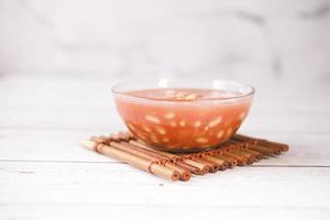 Tasty baked beans in a bowl on table photo