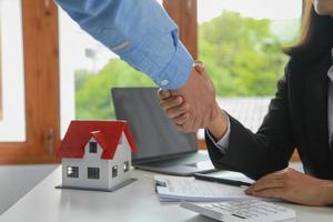 Guarantees, Mortgages, Signings, contract, agreement concept, Real estate agents shake hands with clients after signing the contract and congratulate them after reaching an agreement. photo