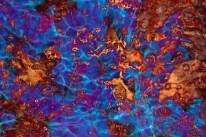 Defocus blurred transparent colorful water splash. Clear calm water surface texture with splashes and bubbles. Trendy abstract nature background. Water waves in sunlight. photo