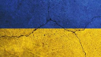 Ukraine flag. Ukraine flag on cracked cement wall photo