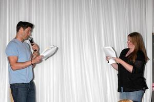 LOS ANGELES, AUG 25 - Daniel Goddard, Fan doing a scene from a YnR script at the Goddard and Khalil Fan Event at the Universal Sheraton Hotel on August 25, 2013 in Los Angeles, CA photo