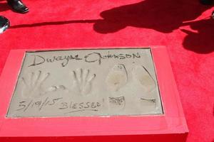 LOS ANGELES, MAY 19 - Dwayne Johnson hand and footprints at the Dwayne Johnson Hand and Foot Print Ceremony at the TCL Chinese Theater on May 19, 2015 in Los Angeles, CA photo