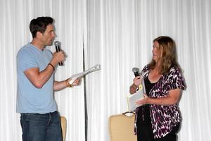LOS ANGELES, AUG 25 - Daniel Goddard, Fan doing a scene from a YnR script at the Goddard and Khalil Fan Event at the Universal Sheraton Hotel on August 25, 2013 in Los Angeles, CA photo