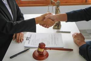 Law, Counsel, Agreement, Contract, Lawyer, advising on litigation matters and shaking hands in contracts as lawyers to receive complaints from clients. concept lawyer photo