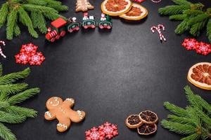 Festive Christmas table with appliances, gingerbreads, tree branches and dried citrus trees