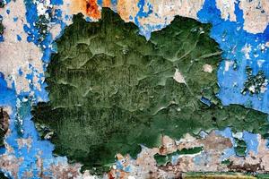 Texture of a brick wall with cracks and scratches which can be used as a background photo