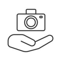 Open hand with camera linear icon. Photo services. Thin line illustration. Taking pictures. Contour symbol. Vector isolated outline drawing