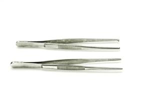 Surgical tweezers isolate on white background. photo