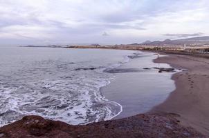 Beach and Wave at Sunrise Time photo