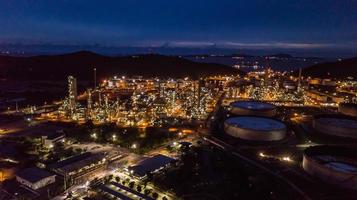 Oil refinery industry at night photo