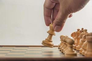 Chess on board with hand , white background photo