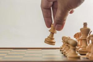 Chess on board with hand , white background photo