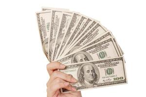 Money, several dollars in hand salary, wages on a white background photo