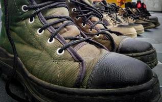 a close up shot of army training boot, shoes lined up after a run. Uttarakhand India. photo