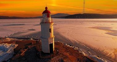 lighthouse in the background of the sunset. Vladivostok, Russia
