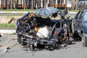 Traffic accident on the street, damaged car after a collision in the city. Accident due to speeding and alcohol intoxication. Transport background. The concept of road safety and insurance. photo