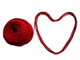 Knitting yarn heart shaped isolated on white background photo